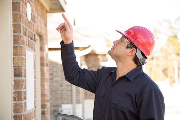 Bird control expert estimating materials before getting a quote from Bird Barrier