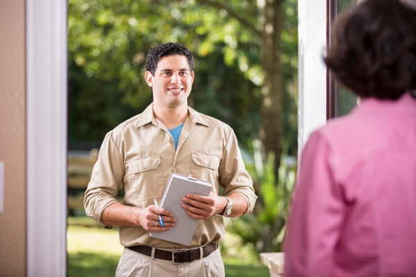 Bird control professional discussing solutions with a customer