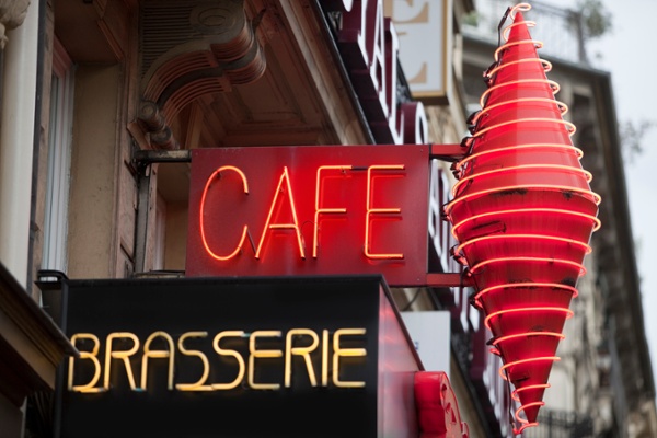 Cafe with a clean neon sign because it uses effective bird control for business signs-1